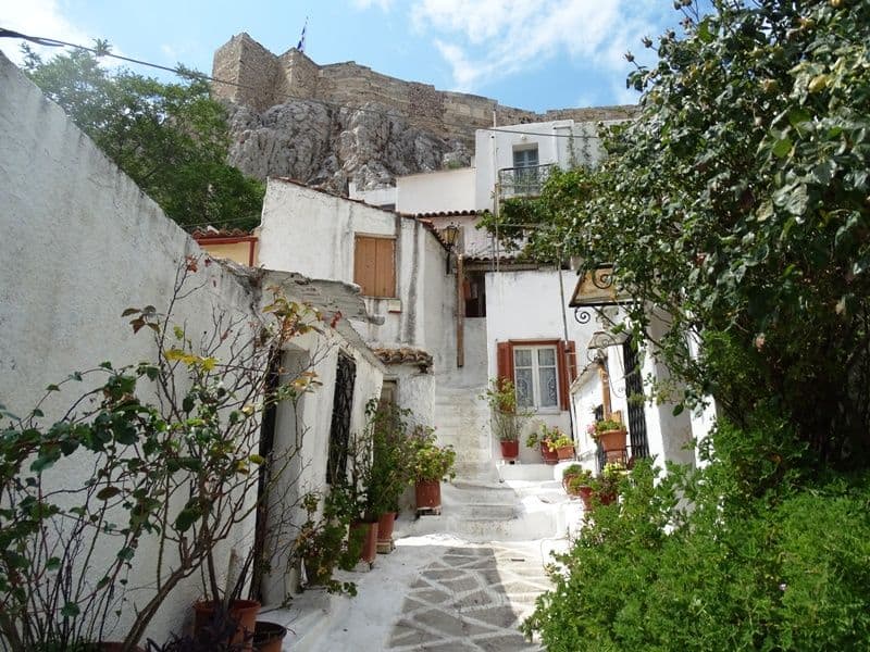 an alleyway in Anafiotika with the Acropolis at the top