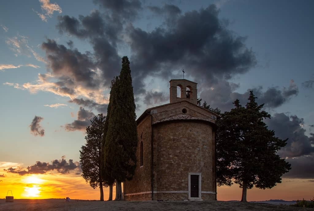 Chapel of the Madonna di Vitaleta in Tuscany at sunset
 